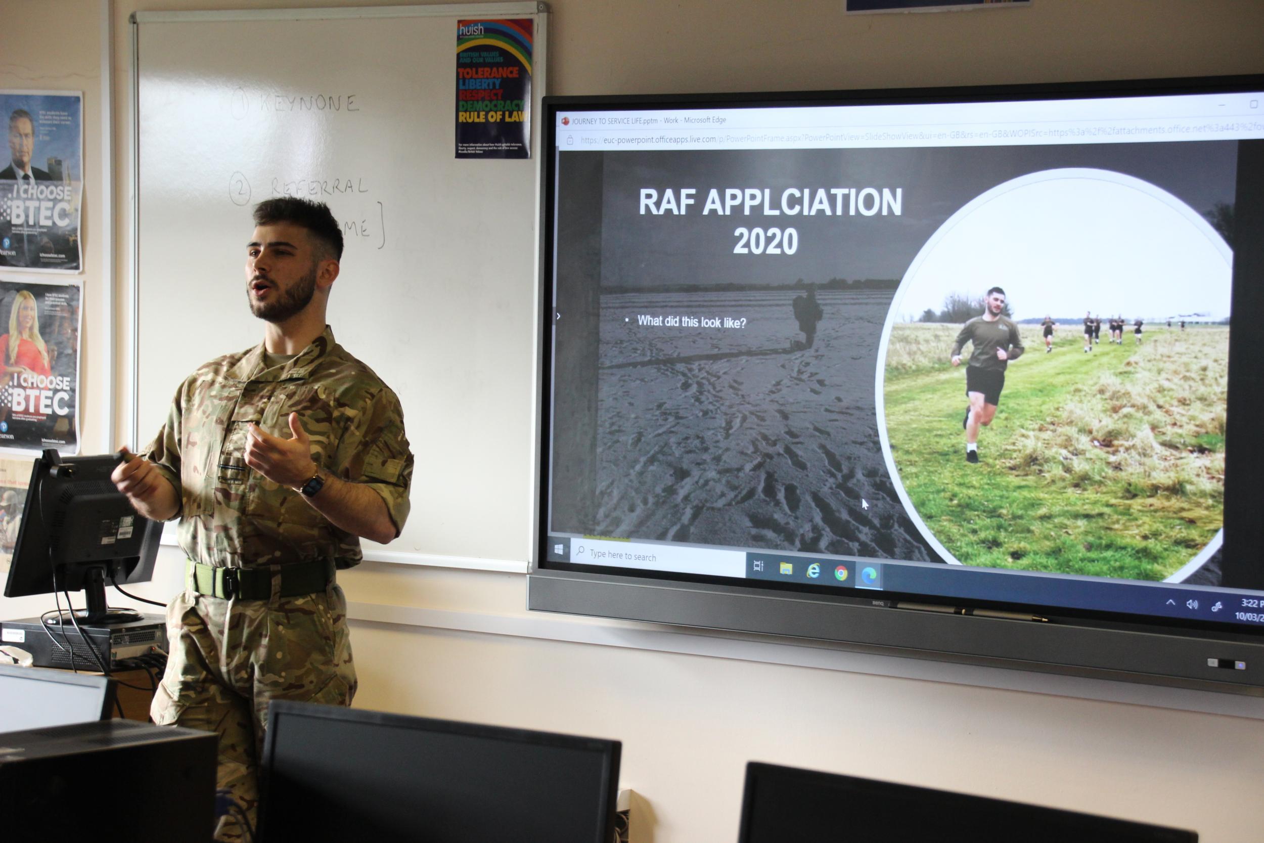 RAF officer in camo clothing speaking to class