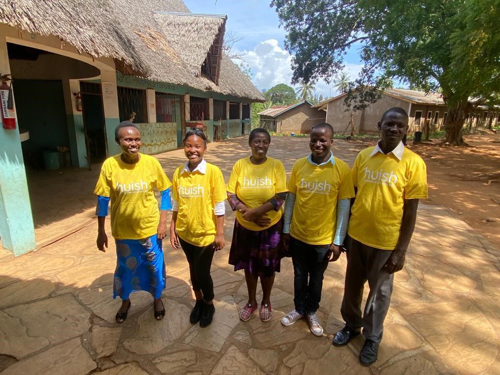 5 teachers in bright yellow Huish t shirts