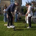 Students with spades outside