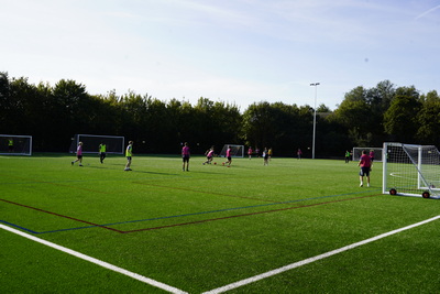 students playing football on a 3G pitch
