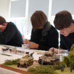 Students painting small models