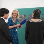 Students explain poster entry