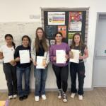5 students standing up who participated in The Richard Huish College Dragons Den 2024