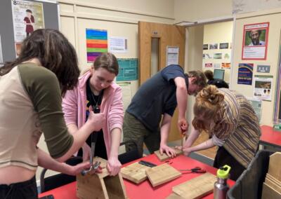 Student sustainability group making bird boxes
