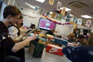 Students packing shoeboxes with gifts