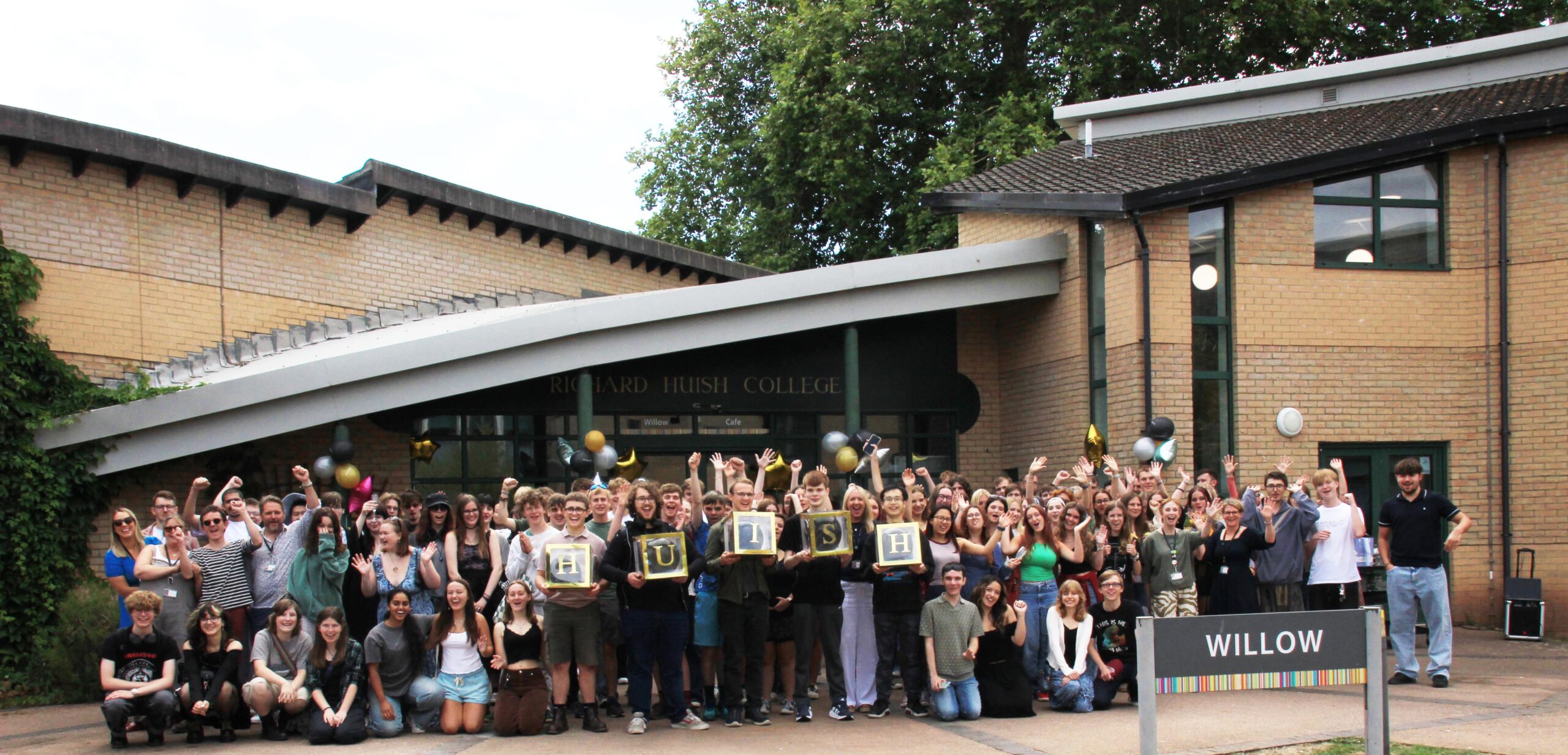Huish Celebration Event Min Large group of students cheering