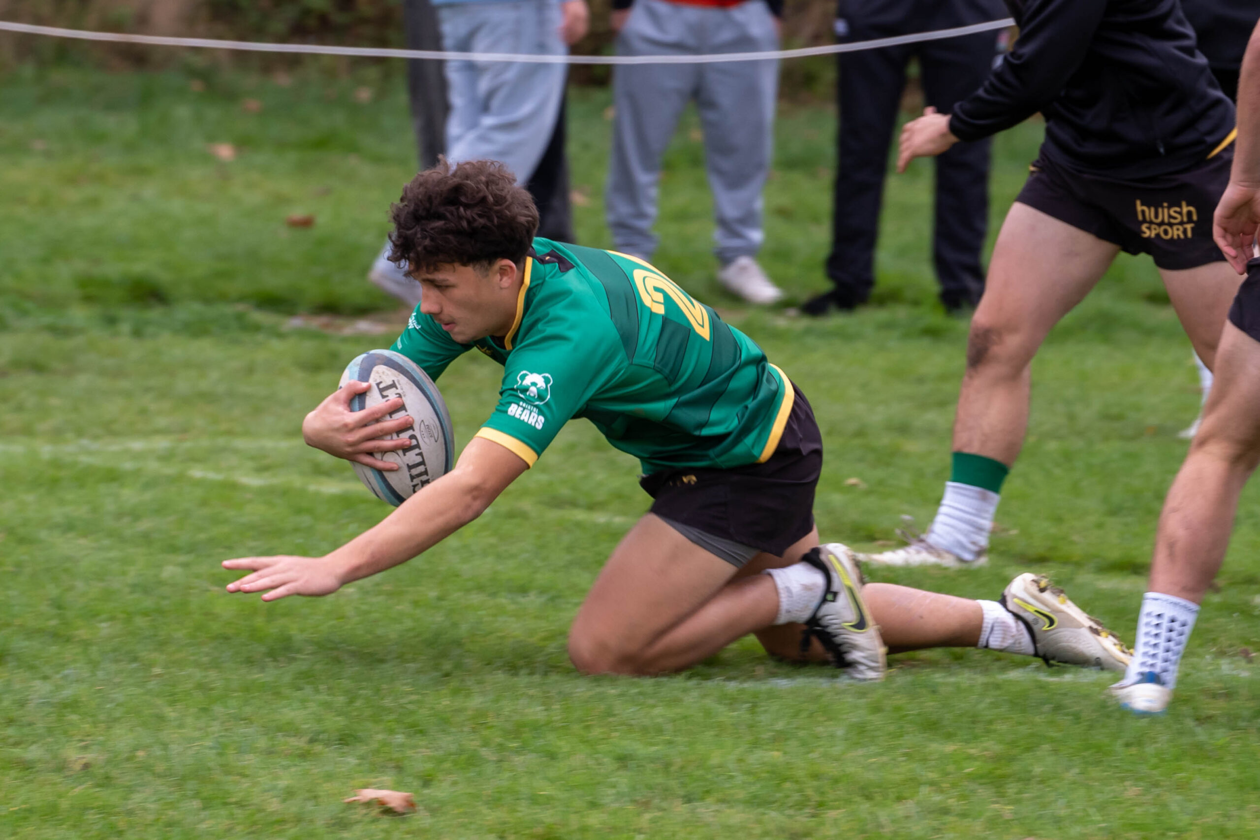 Rugby player diving with ball