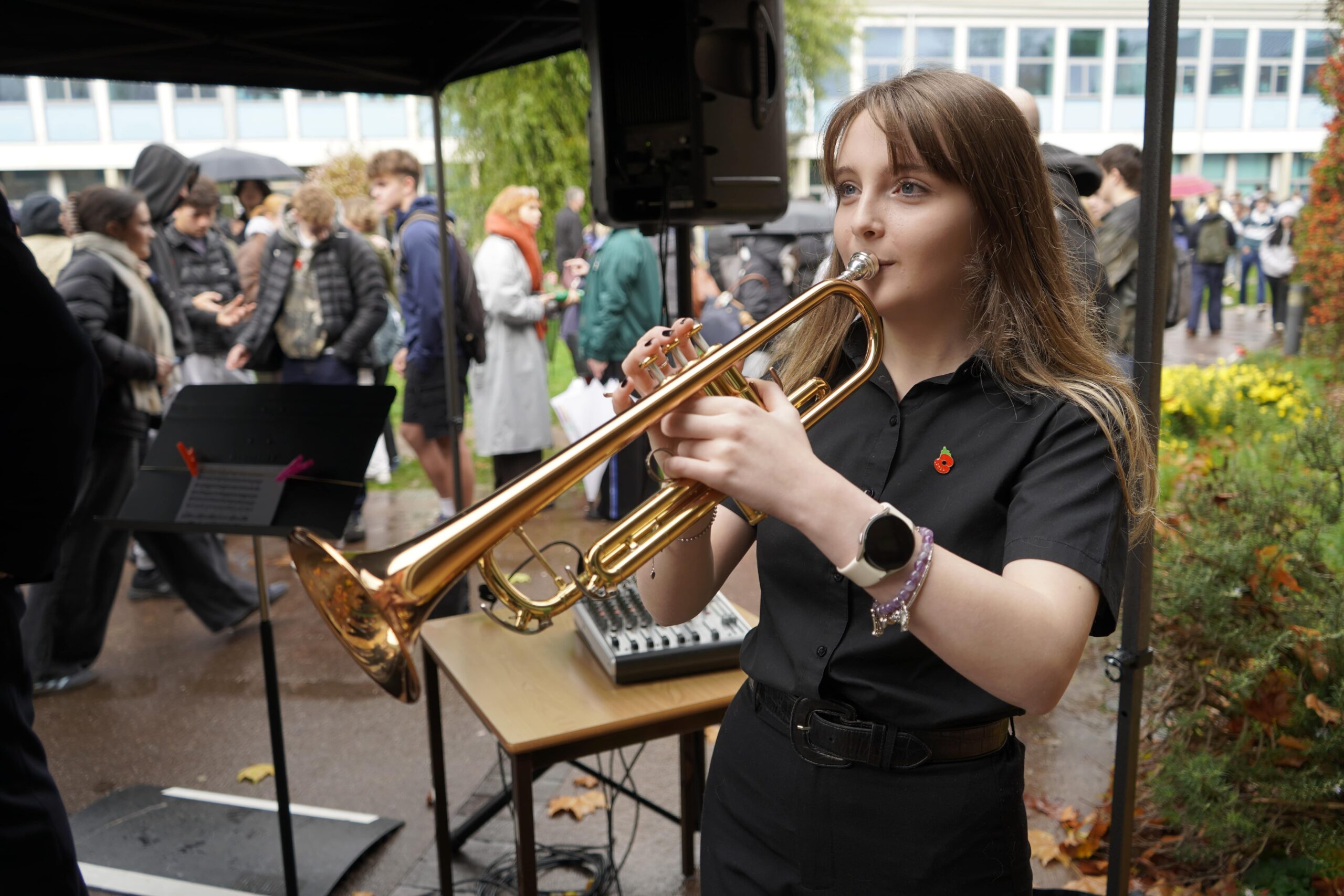 A student holds a trumpet.