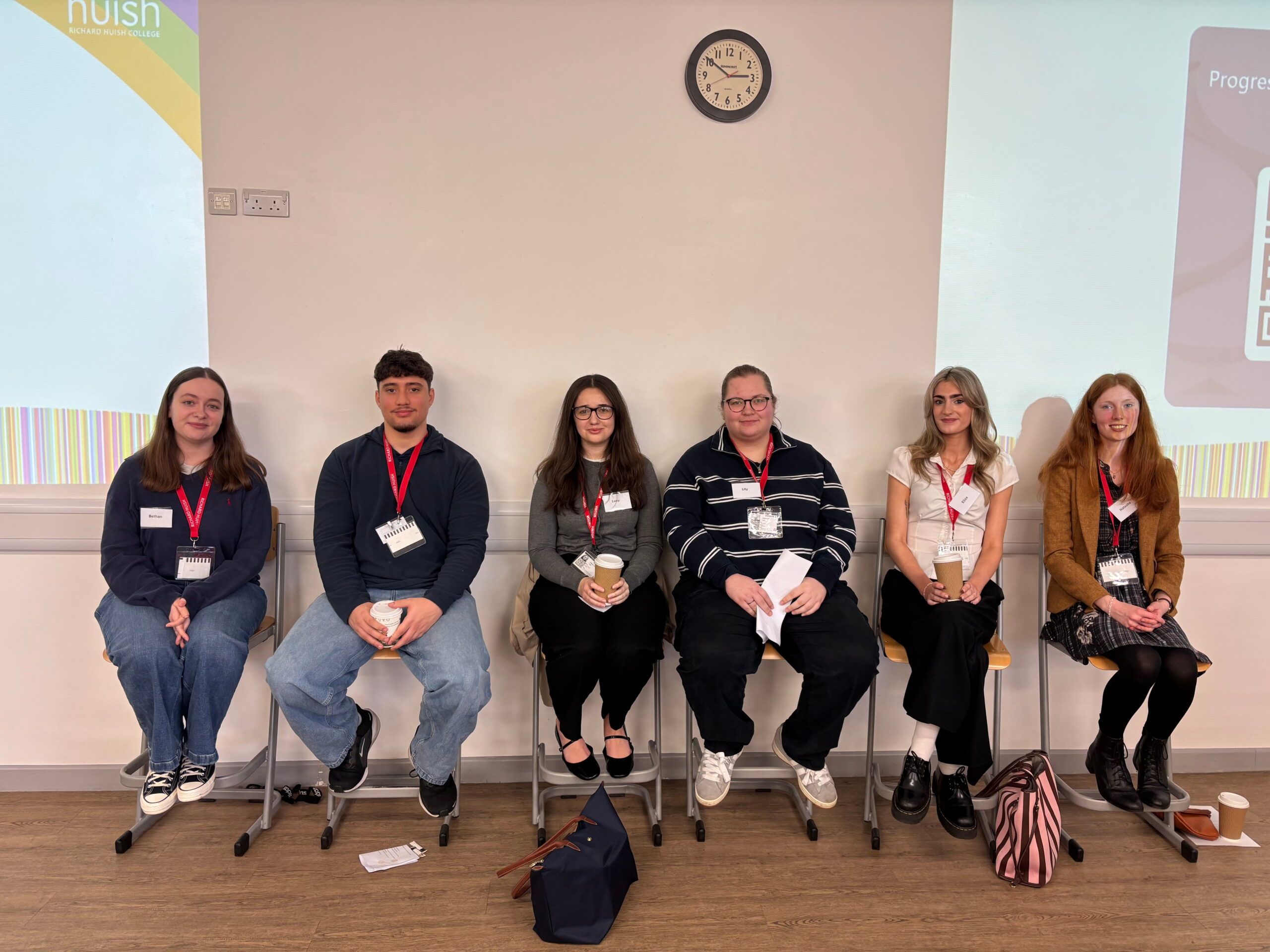 6 Alumni of Huish sat on chairs