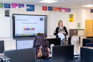 A teacher presenting to a class.