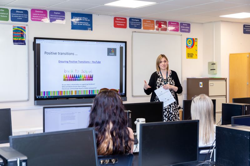 A teacher presenting to a class.