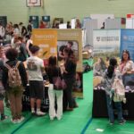 A busy careers fair, with lots of different exhibition stands.