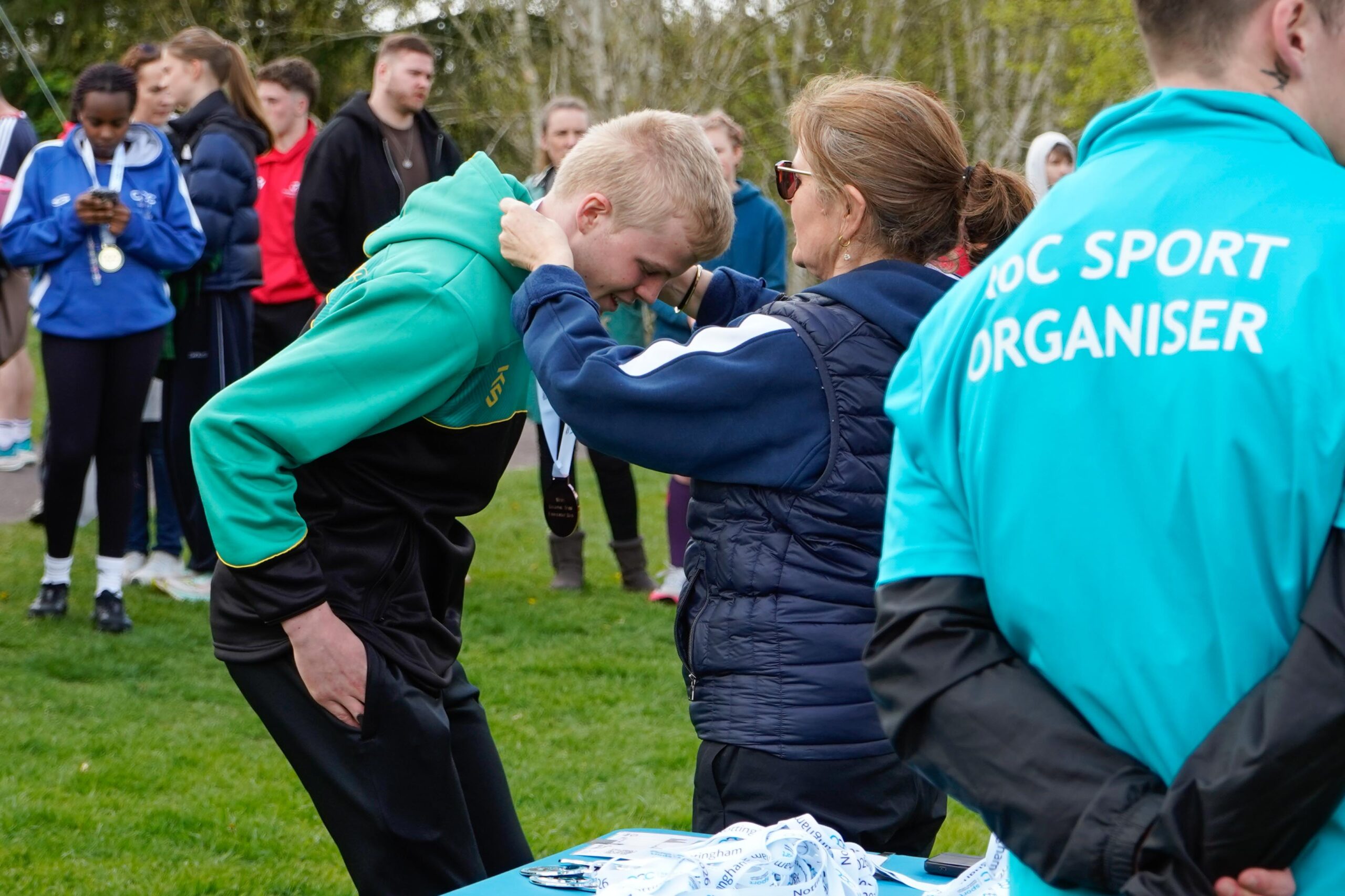 Runner receiving medal