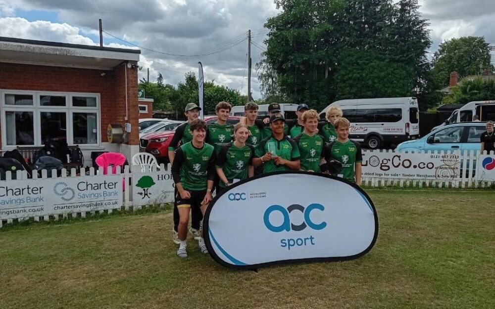 Cricketers stood by AOC Sport sign