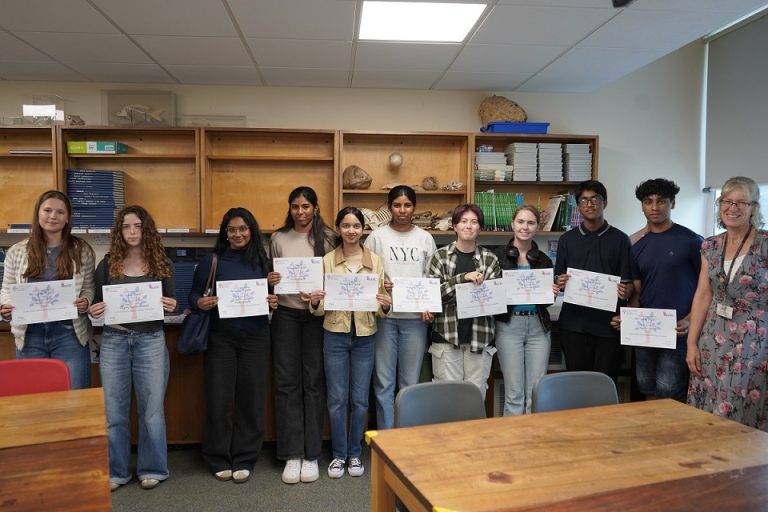Students holding certificates