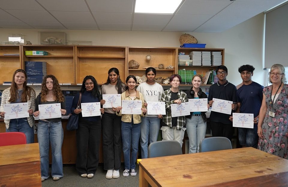 Students holding certificates