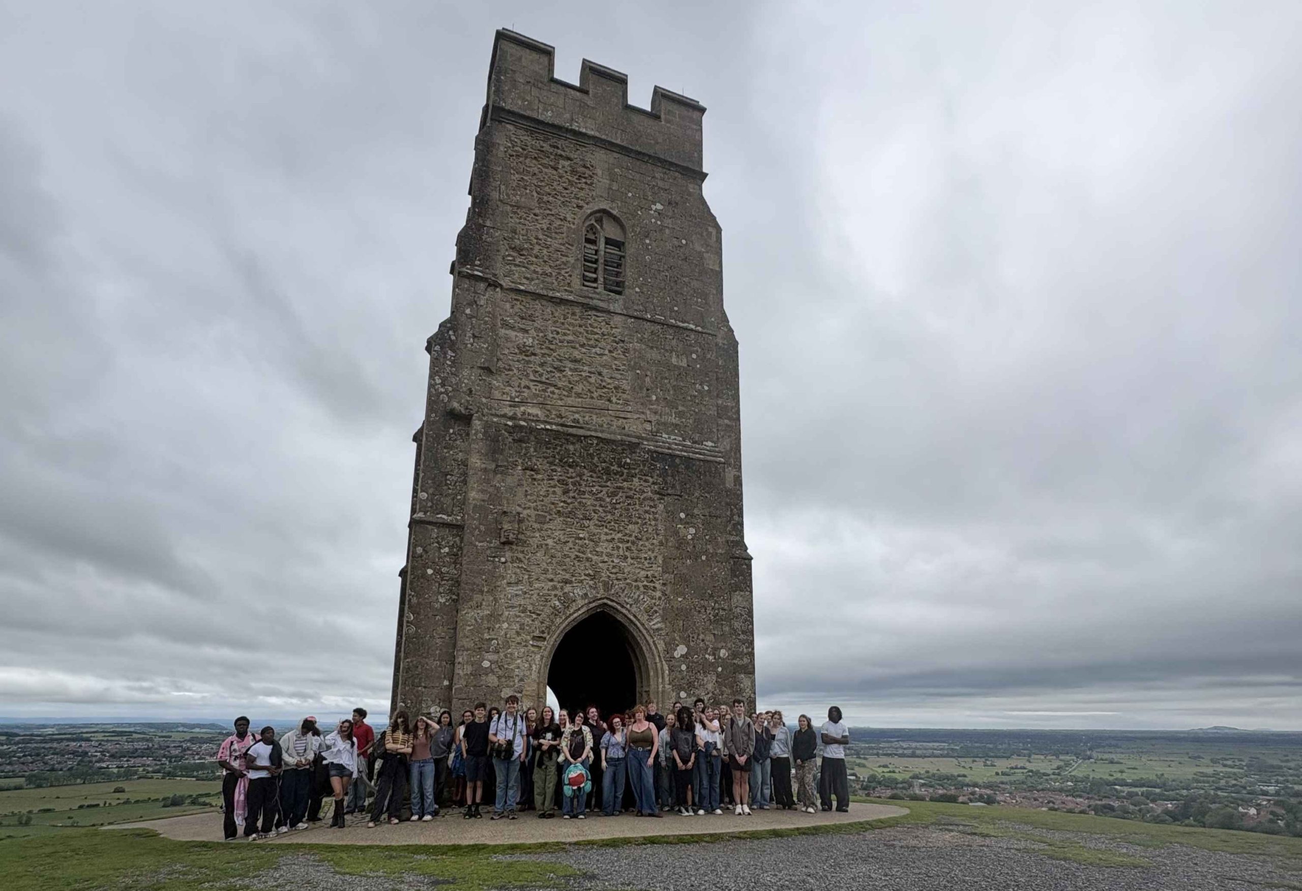 Lots of students stood on top of Glastonbury Tor.
