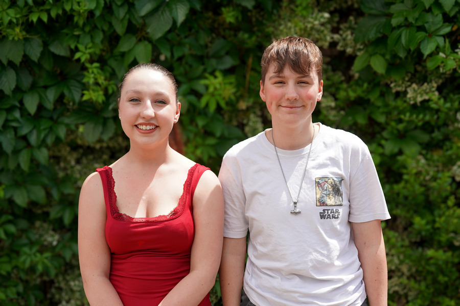 Two student governors stood with one another by a tree